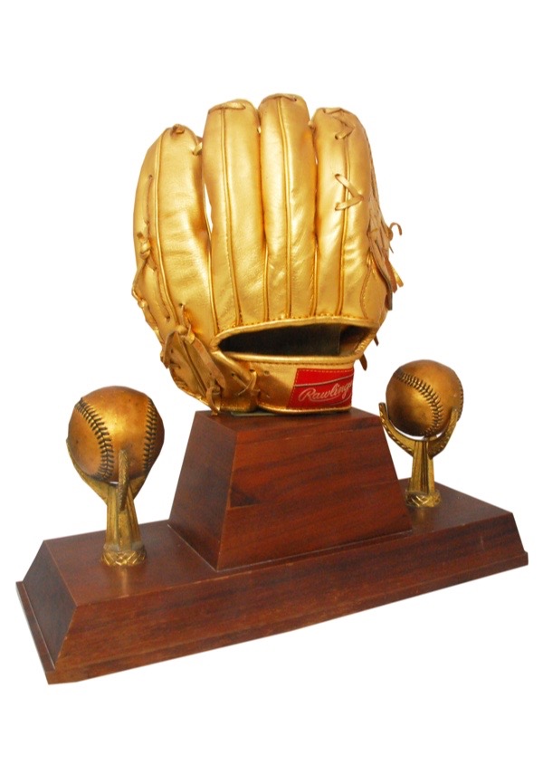 golden baseball glove trophy on white Stock Photo - Alamy
