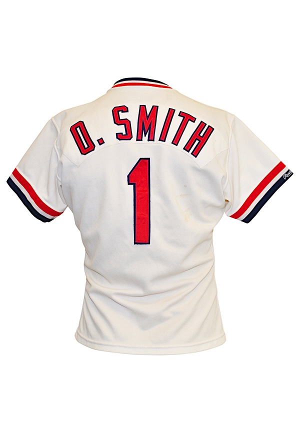 Lot - OZZIE SMITH AUTOGRAPHED ST. LOUIS CARDINAL JERSEY AND PHOTOGRAPH