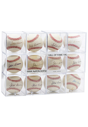 One Dozen Hank Aaron Single-Signed Baseballs (12)