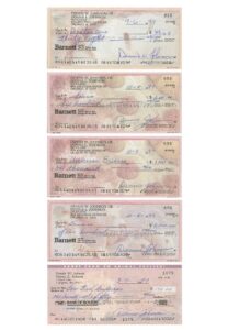 Lot of Dennis Johnson Signed Checks