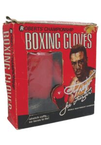 Lot of Joe Frazier Autographed Books & 1970’s Retail Boxing Gloves